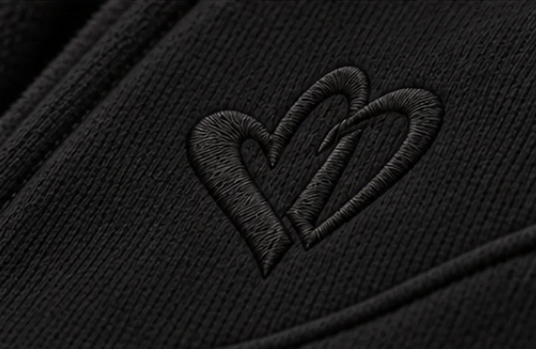 Cold Hart Zip Hoodie in Black, close view of the double Hart embroidered at the chest (design mockup)
